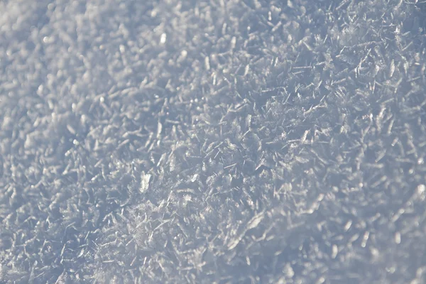 Зимняя текстура - деталь снега с солнцем и кристаллами — стоковое фото