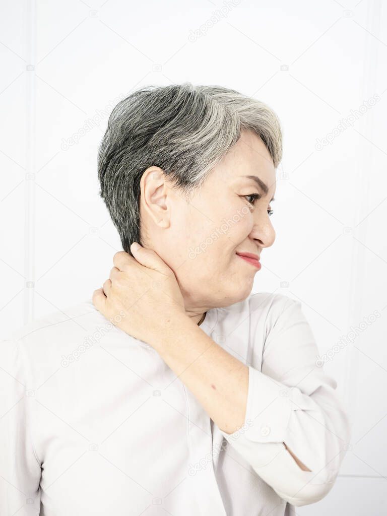 Sick senior adult elderly women touching the neck have shoulder and neck pain.Healthcare and medicine concept