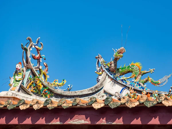 Asia culture concept - Roof with beautiful decoration of famous heritage landmark, the traditional old oriental Chinese temple in Taiwan.