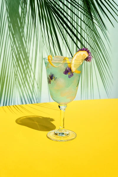 Cocktail Blue Colored Table Sun Shadows Blue Yellow Background Palm — Stock Photo, Image