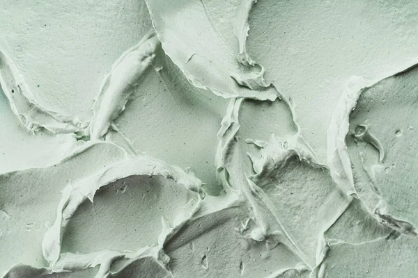 Yeşil kozmetik kil maske dokusu yakın çekim. Soyut arkaplan, seçici odak.