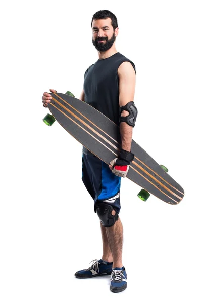 Patinador con su longboard — Foto de Stock