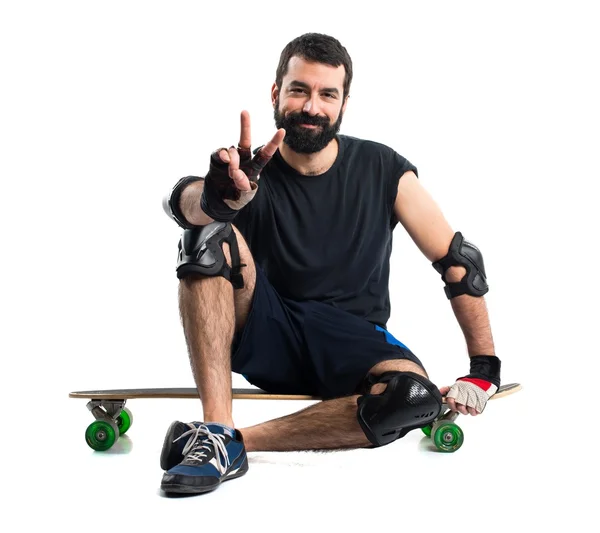 Hombre en su patín contando uno — Foto de Stock