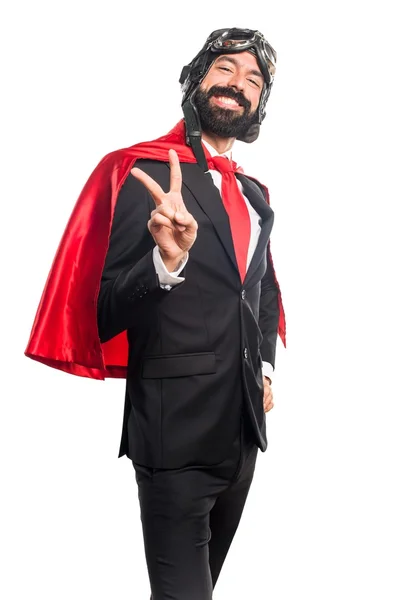 Super herói empresário fazendo gesto de vitória — Fotografia de Stock