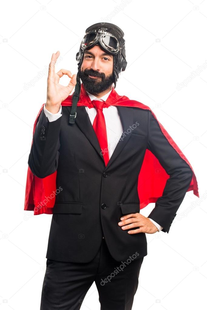 Super hero businessman making OK sign