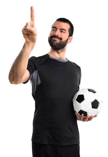 Jugador de fútbol tocando en pantalla transparente —  Fotos de Stock