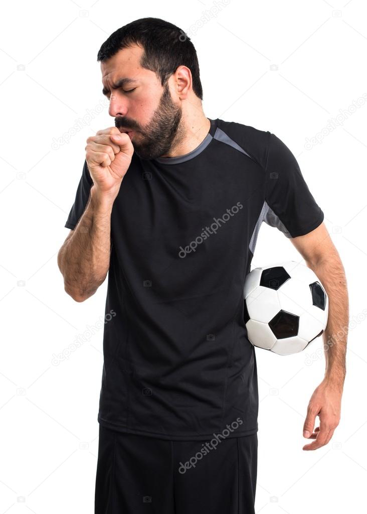 Football player coughing a lot Stock Photo by ©luismolinero 100105624