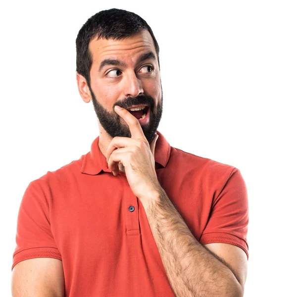 Pohledný muž dělá gesto překvapení — Stock fotografie
