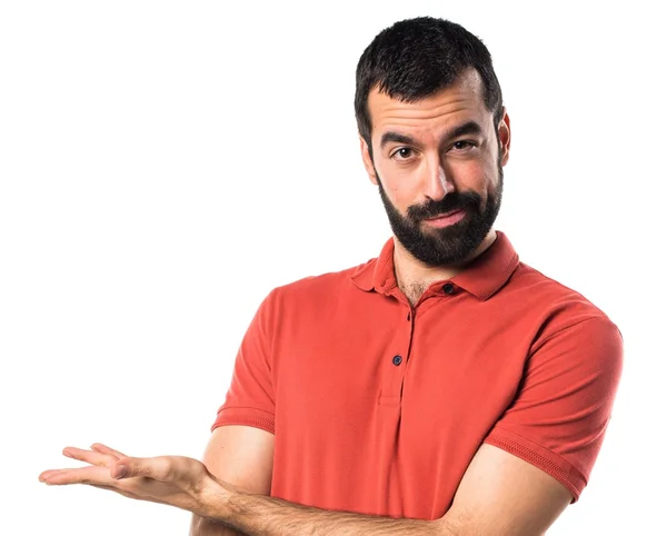 Handsome man presenting something — Stock Photo, Image