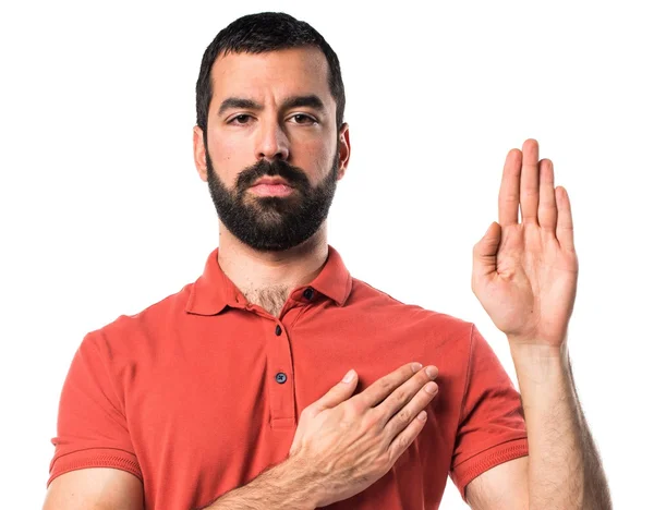 Bonito homem fazendo juramento — Fotografia de Stock