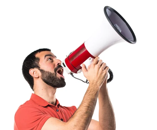 Hombre guapo gritando por megáfono — Foto de Stock