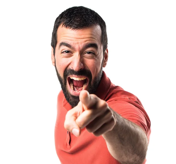 Handsome man pointing to the front Royalty Free Stock Images