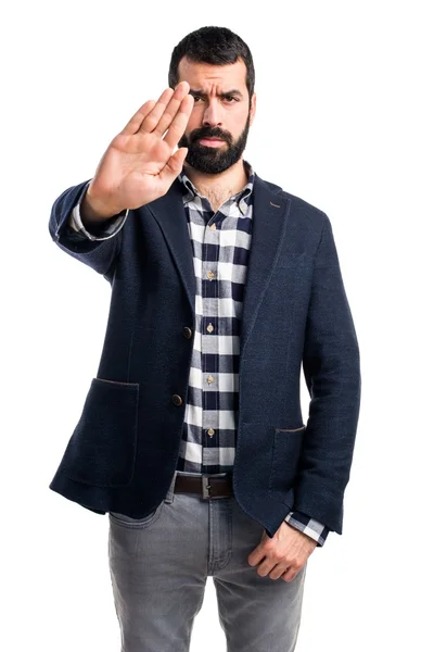 Bonito homem fazendo sinal de parada — Fotografia de Stock