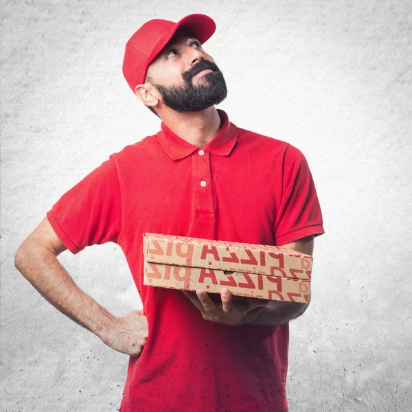 Uomo consegna pizza pensando — Foto Stock