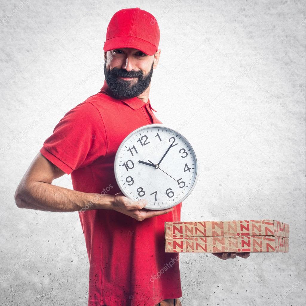 Pizza delivery man holding vintage clock