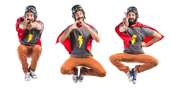 Superhero making a heart with his hands — Stock Photo, Image