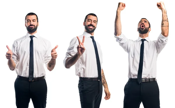 Podnikatel vede vítězství gesto — Stock fotografie