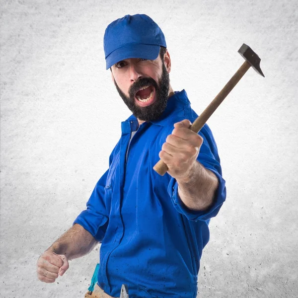 Plumber holding a hammer — Stock Photo, Image