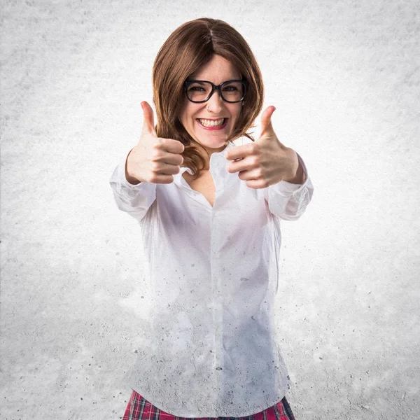 Pretty young girl with thumb up — Stock Photo, Image