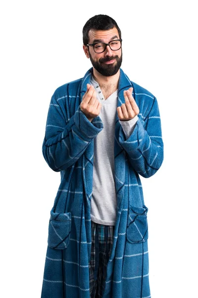 Man in badjas doen een gebaar van geld — Stockfoto