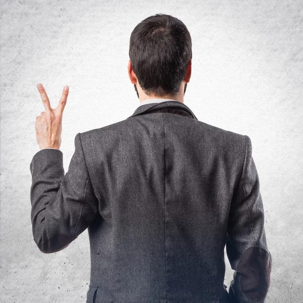 Man doing victory gesture — Stock Photo, Image