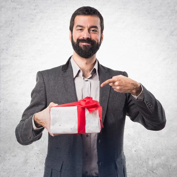 Man holding a gift — Stock Photo, Image