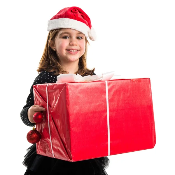 Criança com grande presente vermelho — Fotografia de Stock