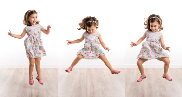 Girl jumping in studio — Stock Photo, Image