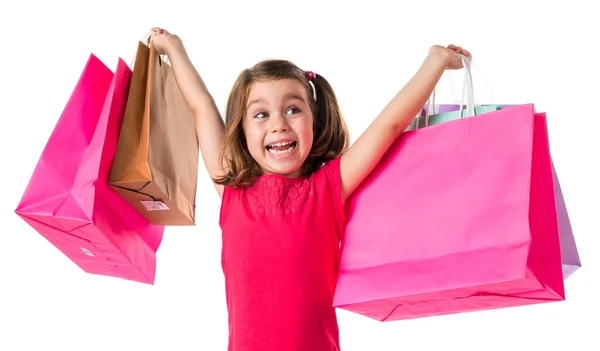 Meisje met veel shopping tassen — Stockfoto