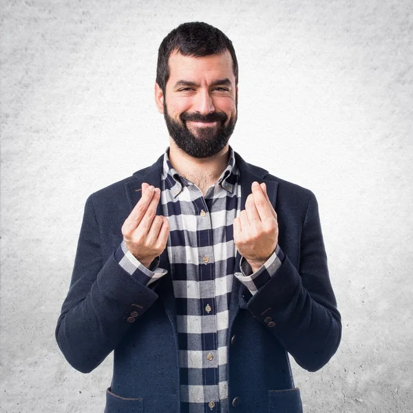 Hombre guapo haciendo un gesto de dinero —  Fotos de Stock