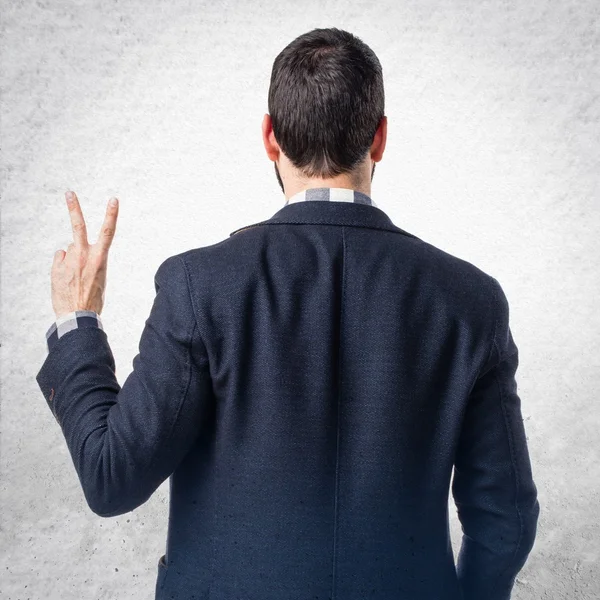 Man doing victory gesture — Stock Photo, Image