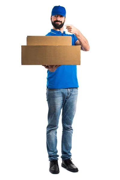 Delivery man pointing to the front — Stock Photo, Image