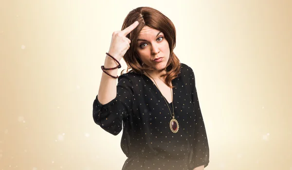 Woman making horn gesture — Stock Photo, Image