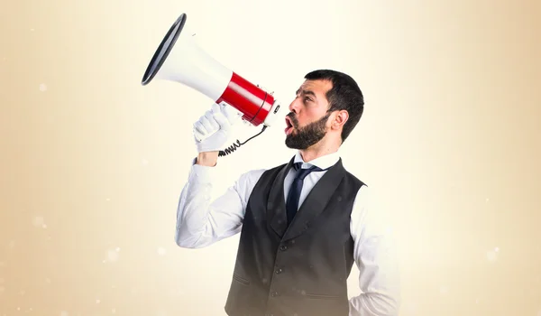 Luxury waiter shouting by megaphone — Stock Photo, Image