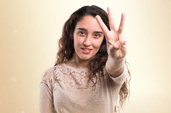 Teenager girl counting three — Stock Photo, Image