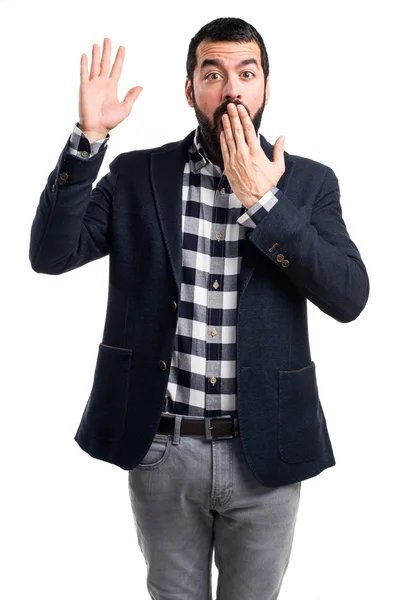 Handsome man doing surprise gesture — Stock Photo, Image