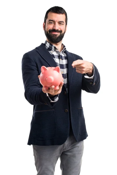 Hombre sosteniendo una hucha — Foto de Stock