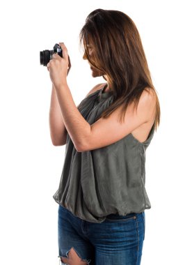 bir kamera tutan genç kız