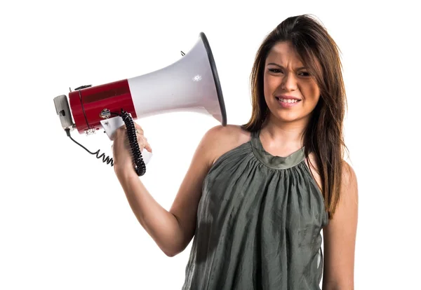 Young girl shouting by megaphone — Stock Photo, Image