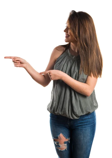 Young girl pointing to the lateral — Stock Photo, Image
