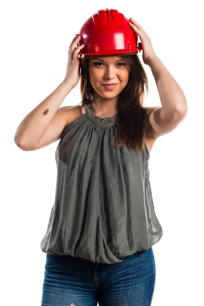 Giovane lavoratrice con cappello rosso — Foto Stock