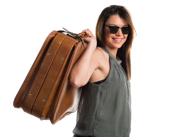 Chica joven sosteniendo un maletín — Foto de Stock