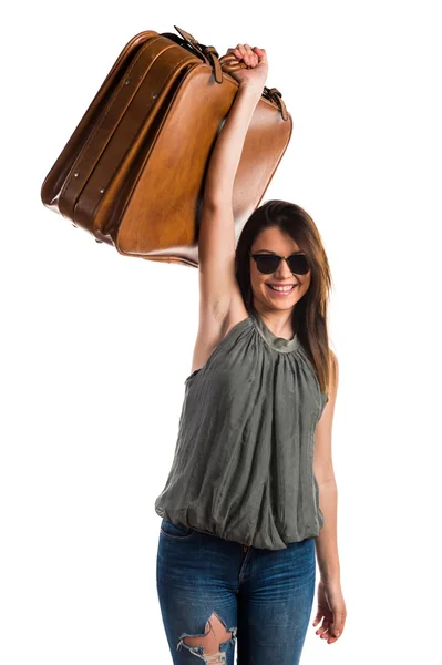 Chica joven sosteniendo un maletín — Foto de Stock