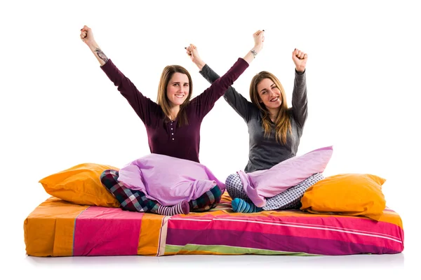 Lucky friends on bed — Stock Photo, Image