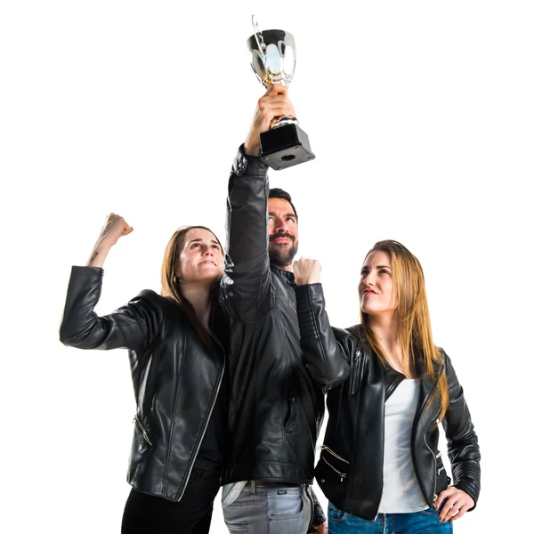 People holding a trophy — Stock Photo, Image