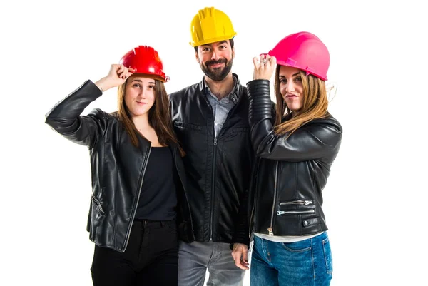 Gente de trabajo con sombreros coloridos —  Fotos de Stock