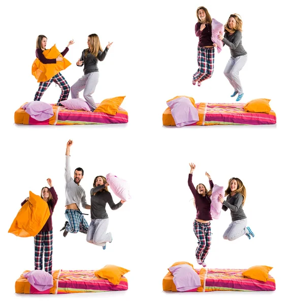 Friends jumping on bed — Stock Photo, Image