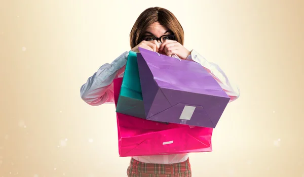 Mulher com muitos sacos de compras — Fotografia de Stock