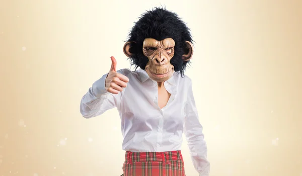 Girl with monkey mask with thumb up — Stock Photo, Image