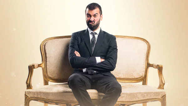 Sad Businessman sitting on armchair — Stock Photo, Image